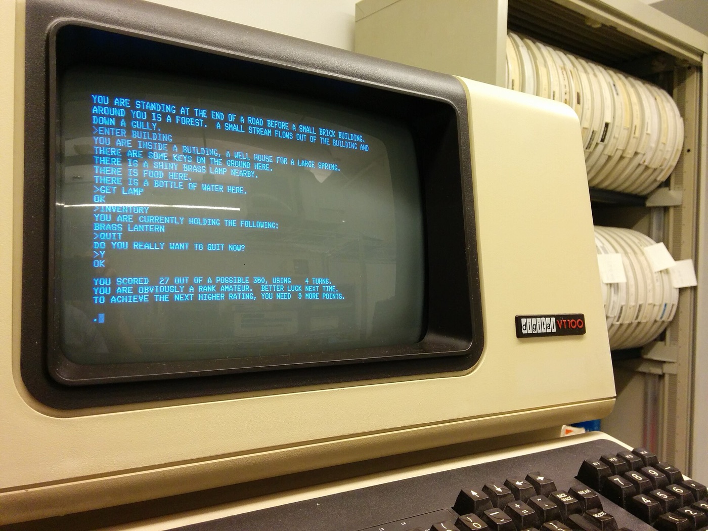 DEC VT100 computer terminal displaying glowing text on its CRT screen