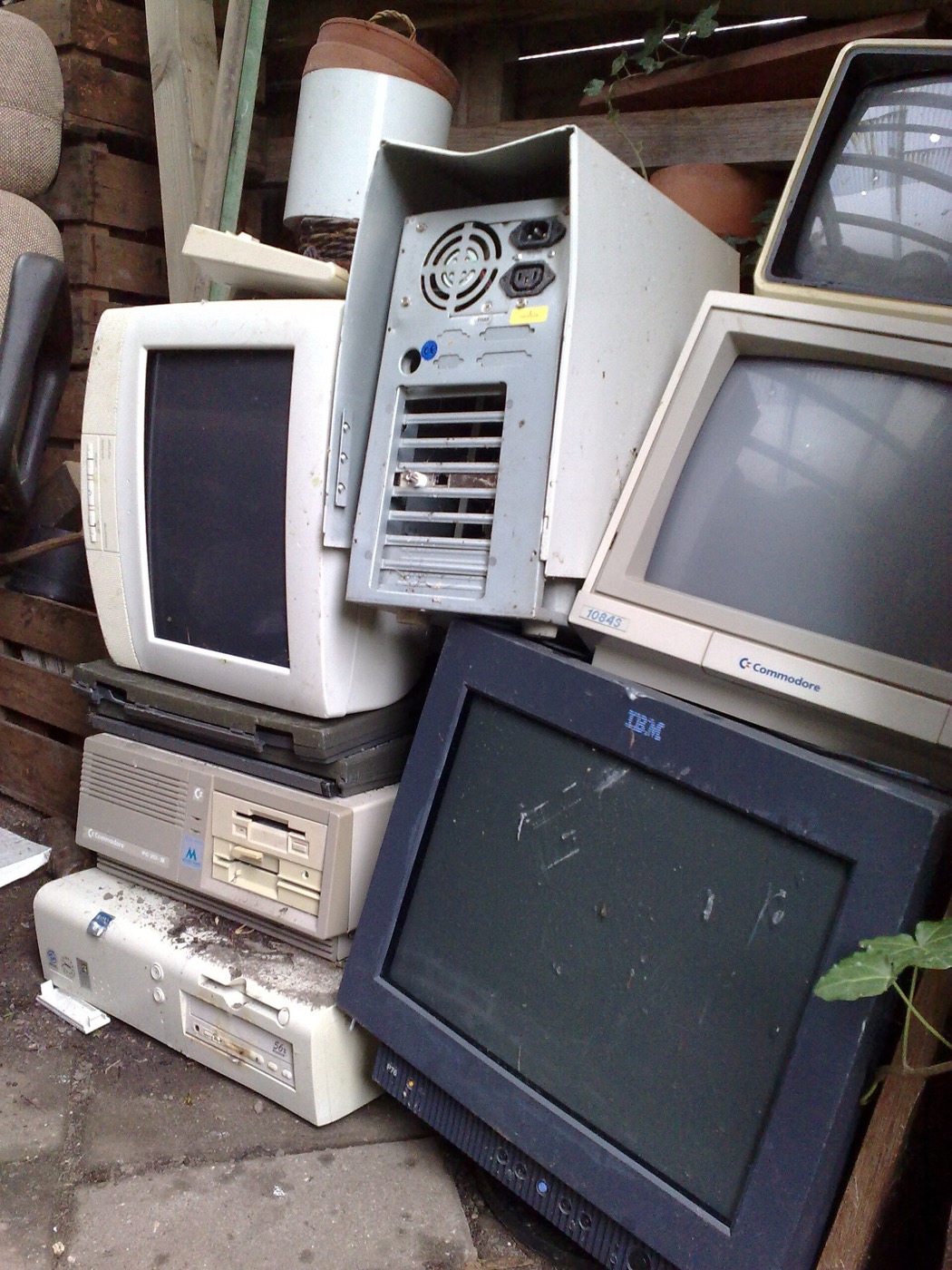Pile of discarded CRT televisions awaiting recycling