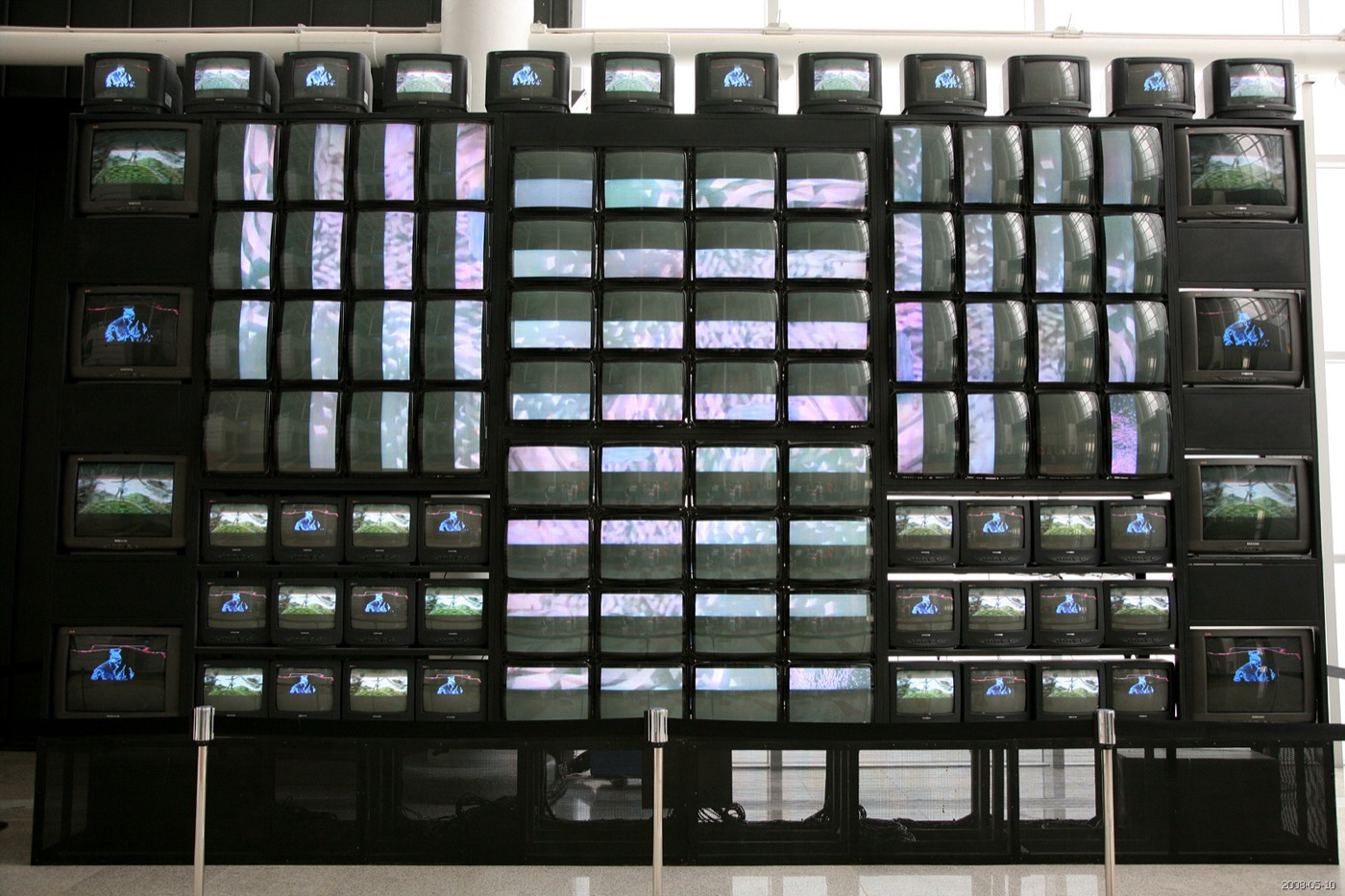Nam June Paik sculpture built from stacked glowing CRT televisions